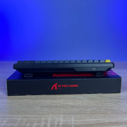 Keyboard with 'Attack Shark' branding on a blue gradient background