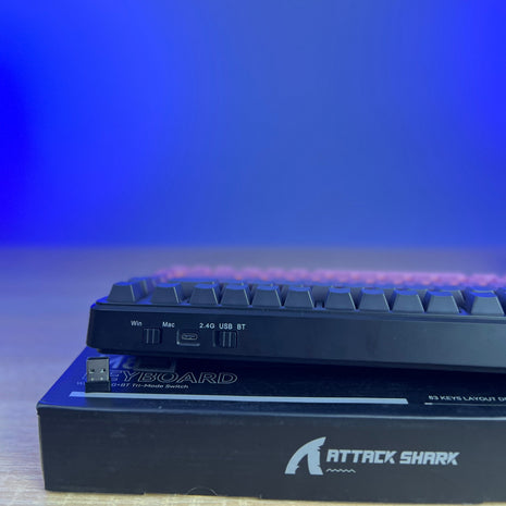 Keyboard with 'Attack Shark' branding on a blue gradient background