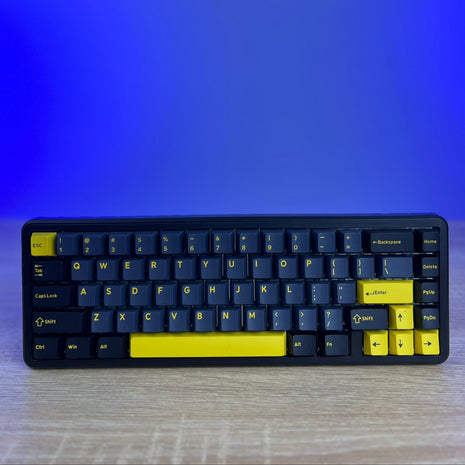Keyboard with blue and yellow keys on a gradient blue background