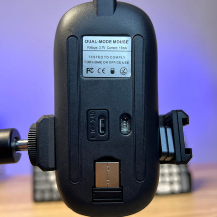 Black electronic device with USB port on a blurred background
