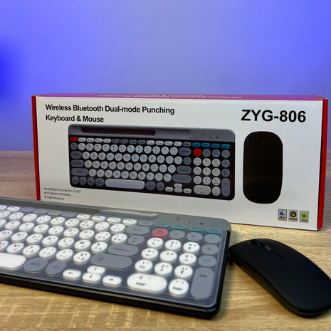 Keyboard and mouse set with ZYG-806 packaging on a wooden surface