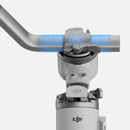 DJI action camera with a handle on a white background